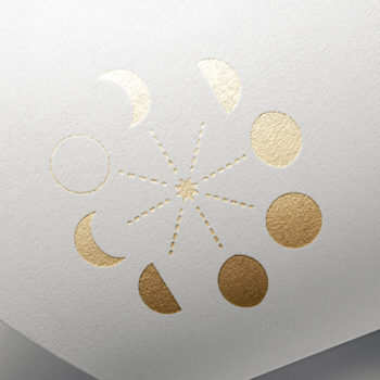 Gold letter pressed moon phase logo of Thread